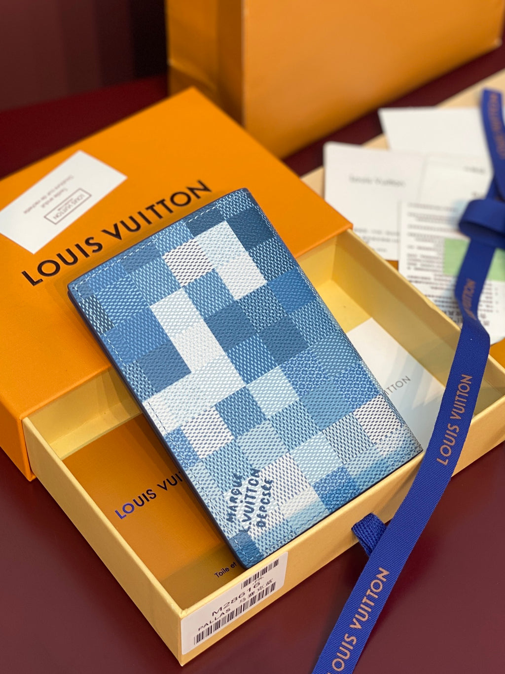 Louis Vuitton small bag with blue and white Damier Azur checkered exterior