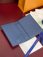 Louis Vuitton blue grained leather wallet-style bag with open interior pockets