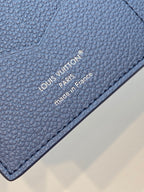 Louis Vuitton small bag in blue textured leather, stitched edge and branding