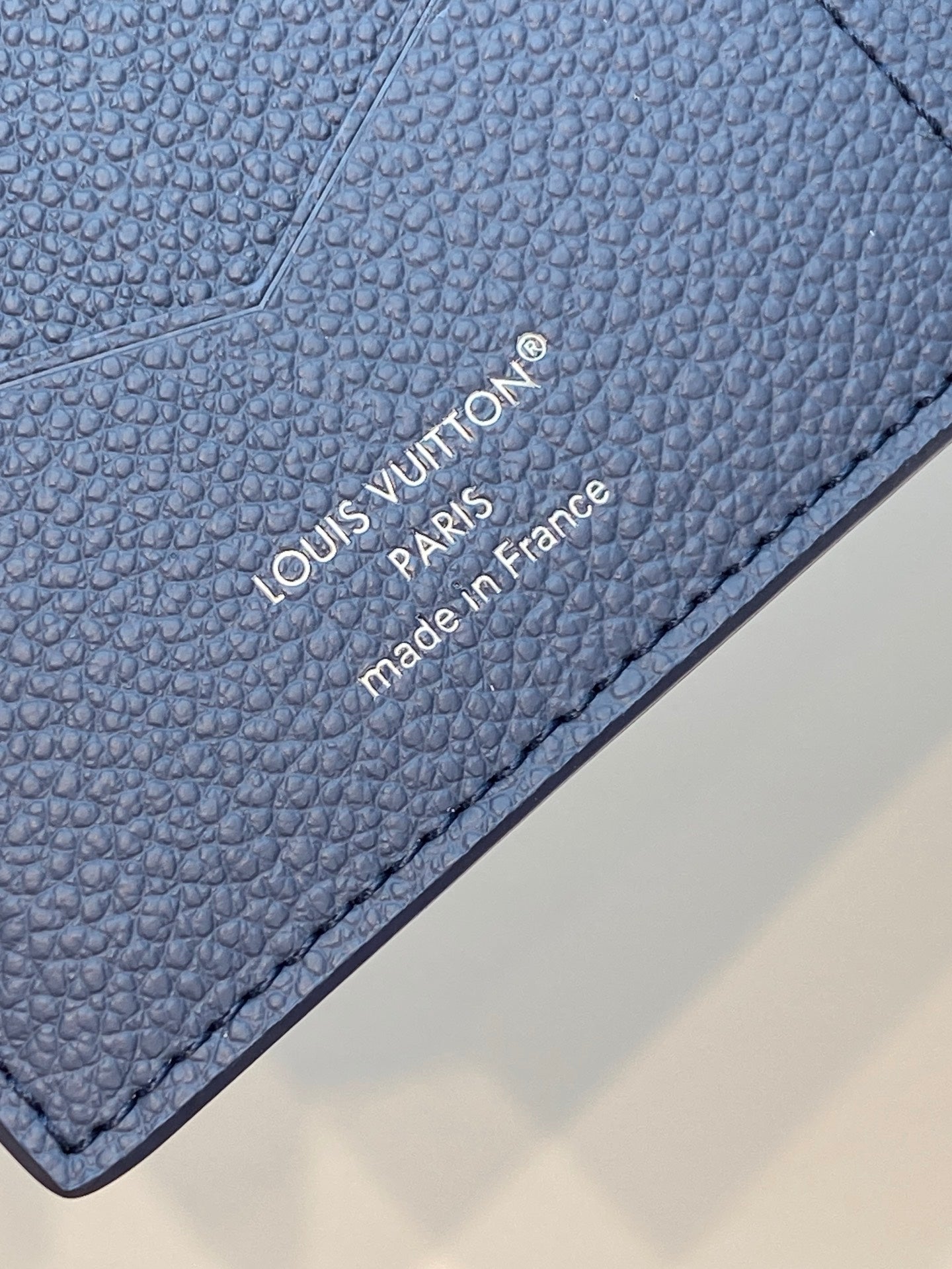 Louis Vuitton small bag in blue textured leather, stitched edge and branding