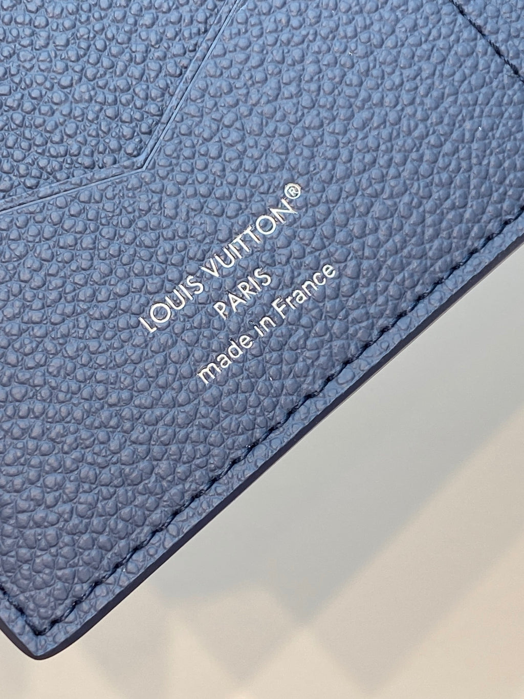Louis Vuitton blue leather bag with engraved 'made in France' stamp