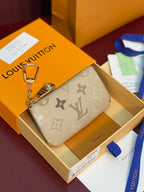 Louis Vuitton beige monogram small zipper bag with gold-tone chain clasp