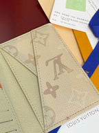 Monogram card holder open view, beige canvas inner panels with card slots