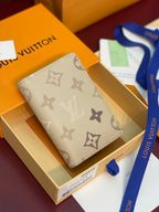 Beige monogram card holder wallet with logo pattern and tan interior accents