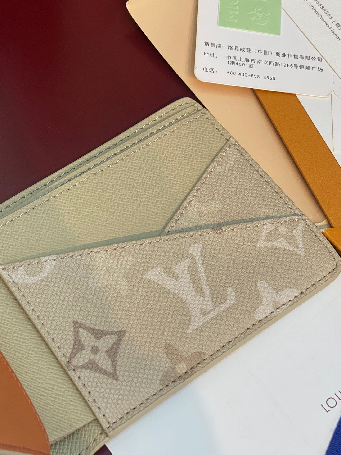 Louis Vuitton monogram card wallet interior detail with stitched panel and card slot