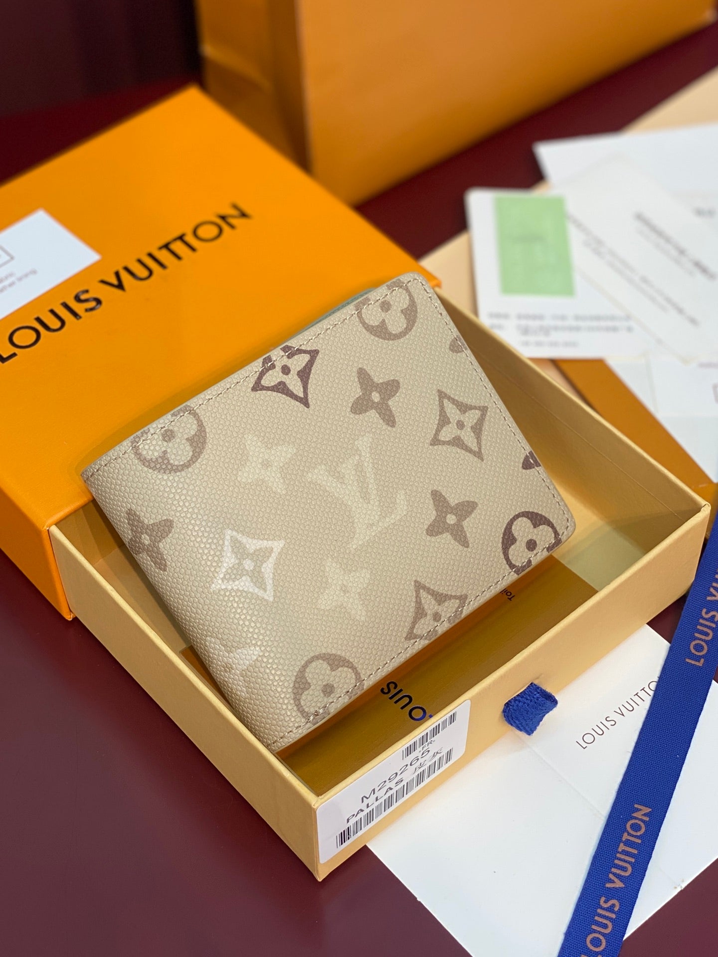 Louis Vuitton small bag in beige monogram canvas with foldover flap and stitching