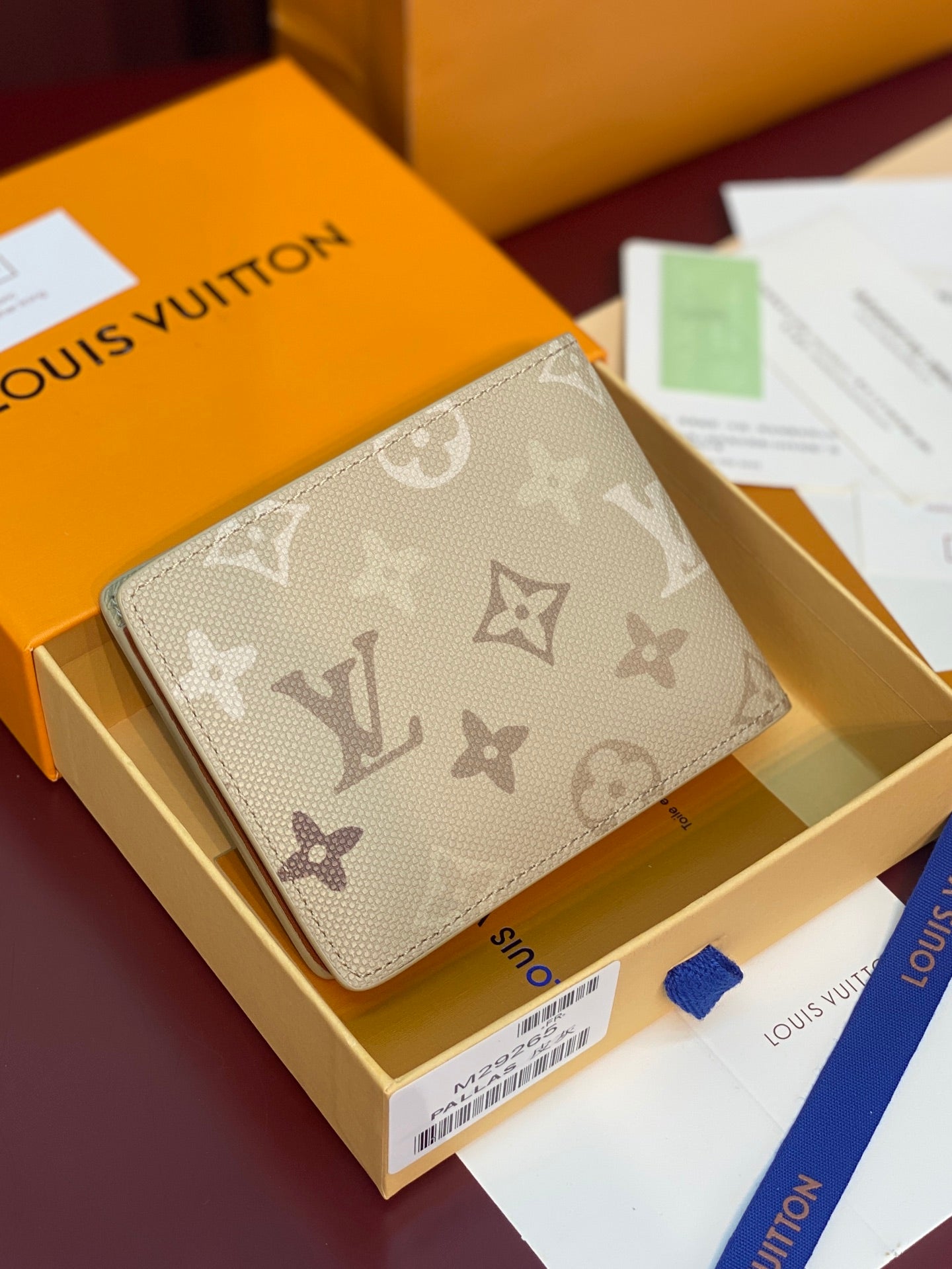 Louis Vuitton monogram card wallet with beige canvas and leather trim, front view