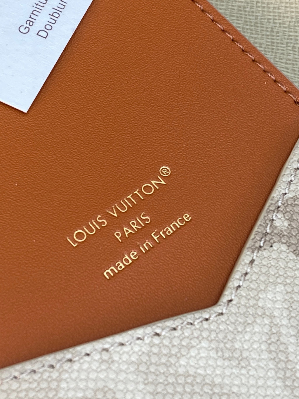 Louis Vuitton small bag leather underside with "made in France" text