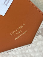 Louis Vuitton small bag leather underside with "made in France" text