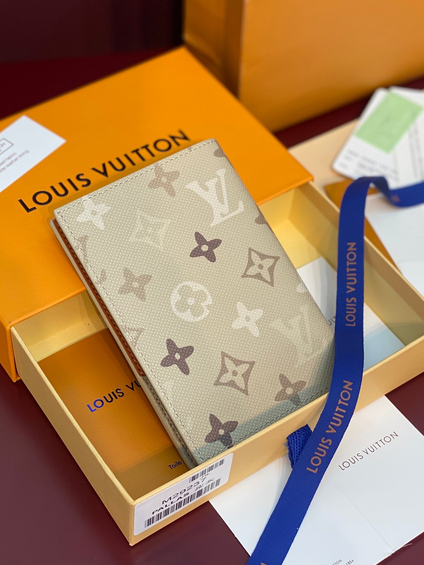 Beige Louis Vuitton monogram card holder with strap bow