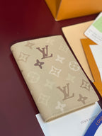 Beige Louis Vuitton monogram card holder, front view