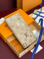 Beige monogram canvas long wallet with fabric strap and Louis Vuitton pattern.
