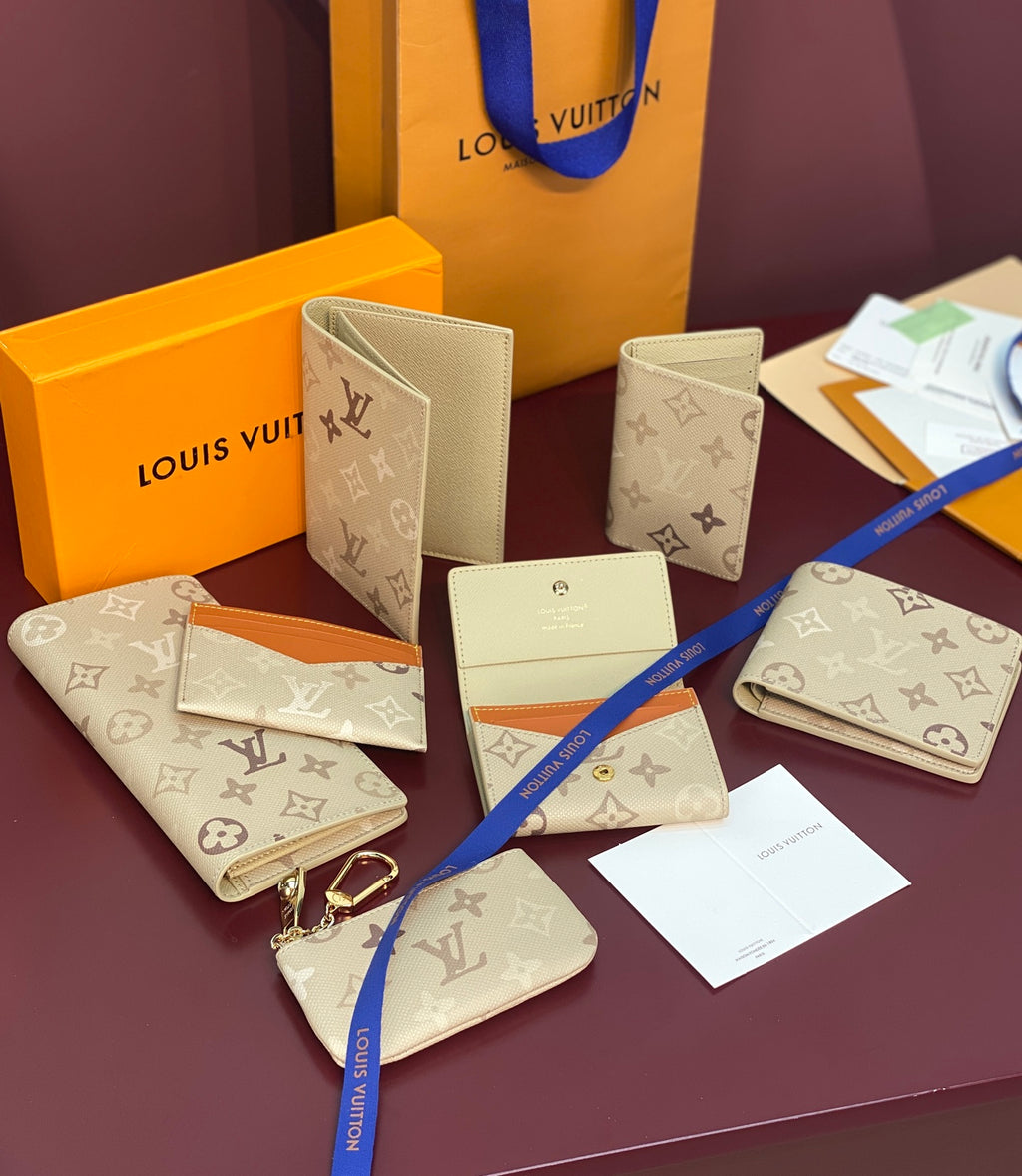 Set of Louis Vuitton monogram small wallets in cream with matching accessories