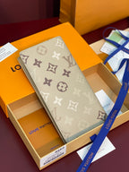 Louis Vuitton monogram long wallet in light gray with repeating logo pattern