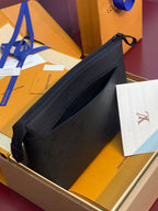 Louis Vuitton small bag in dark blue with top zipper and embossed monogram detail