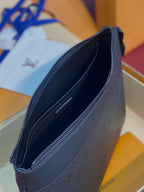 Louis Vuitton dark blue zip pouch bag with embossed monogram texture and smooth trim