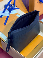Louis Vuitton dark blue shoulder bag with curved flap and zip closure, monogram texture