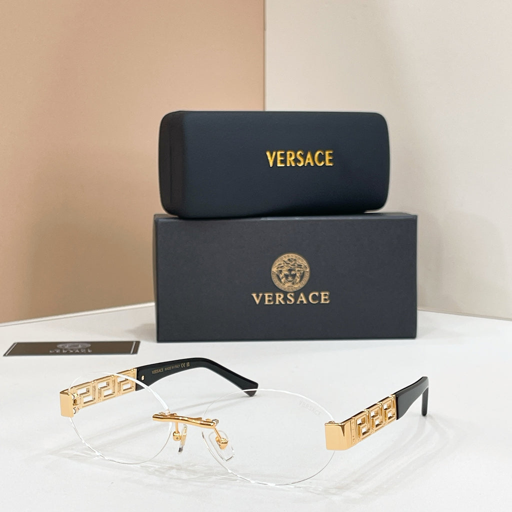 Gold-accent designer eyeglasses with geometric temple detail and clear lenses