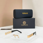 Gold-accent designer eyeglasses with geometric temple detail and clear lenses