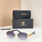 Designer sunglasses with purple lenses, black frame, and gold geometric temple detail