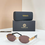 Versace round sunglasses with dark mauve lenses and gold logo temple hardware