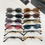 Versace sunglasses assortment with multiple lens colors, featuring Greek key gold temples