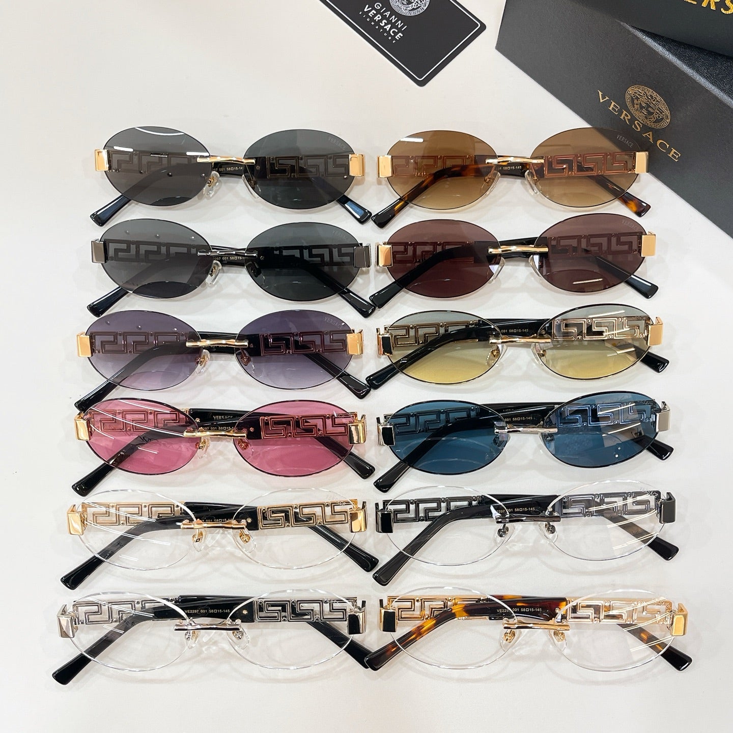 Versace sunglasses assortment with multiple lens colors, featuring Greek key gold temples