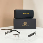 Sunglasses with clear lenses, gold-tone metal frame, dark temple accents