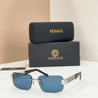 Sunglasses with blue tinted lenses, gold-tone metal frame, blue temple accents