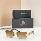 Sunglasses with beige tinted lenses, gold-tone metal frame, tortoise temple accents