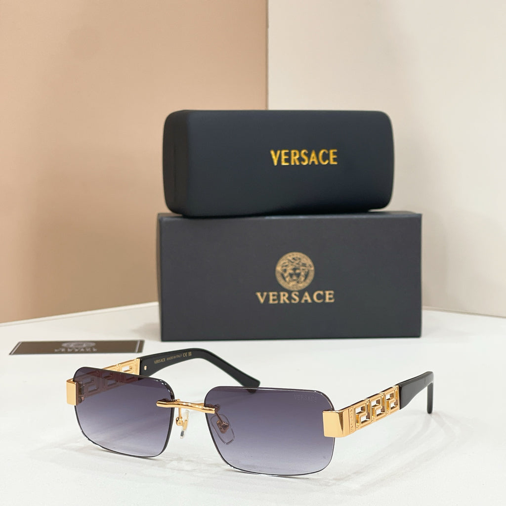 Sunglasses with purple tinted lenses, gold-tone metal frame, dark temple accents