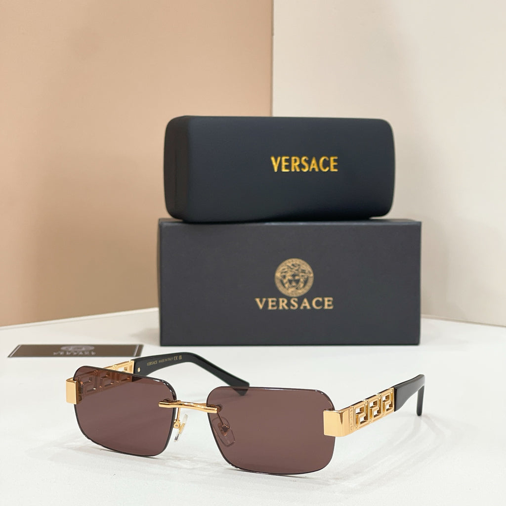 Versace sunglasses with brown lenses, gold frame and Greek-key temple detail