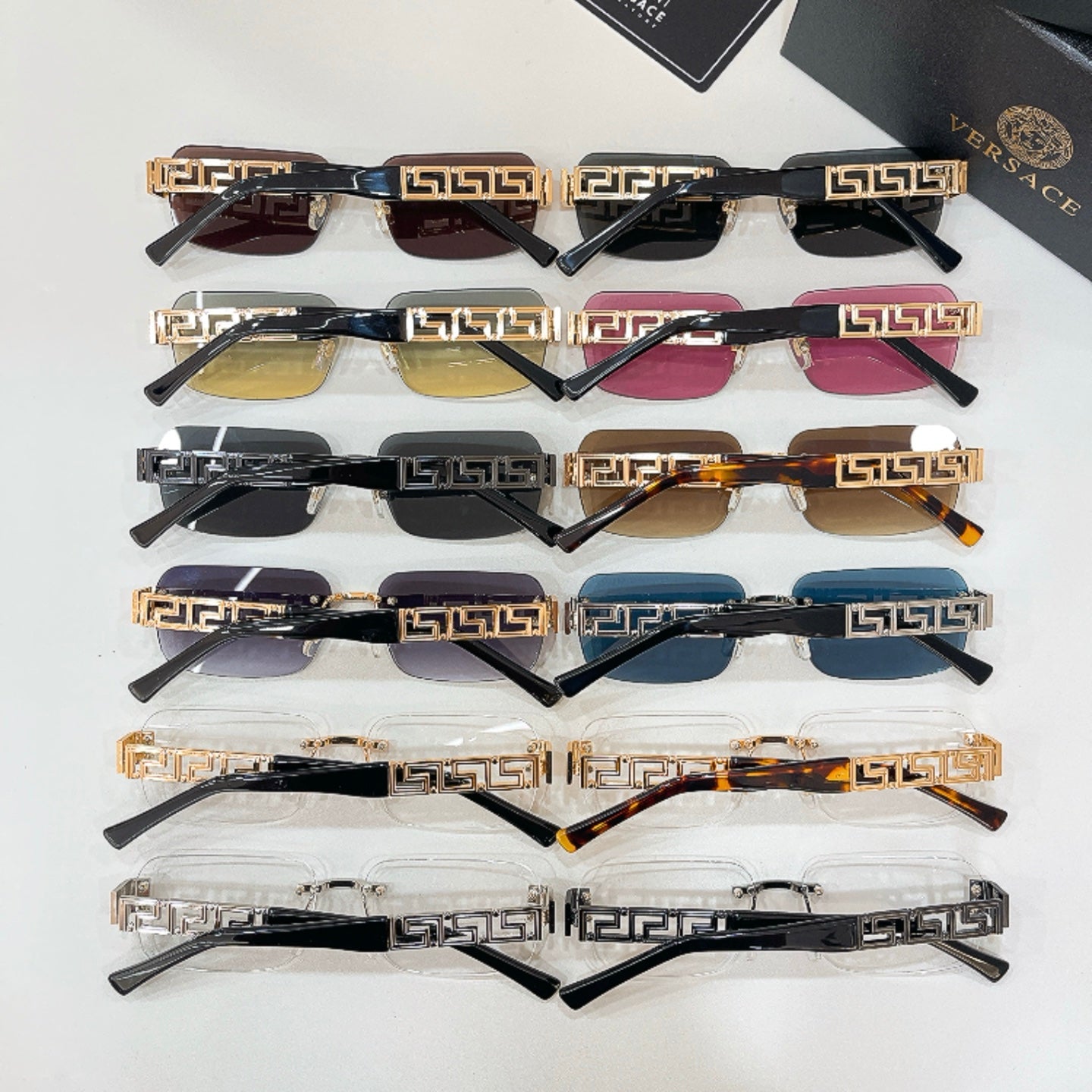 Assorted Versace sunglasses set with mixed lens colors and gold Greek-key frames