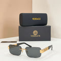 Versace sunglasses with dark lenses, gold frame and temple details