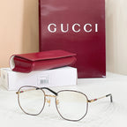 Gold-tone and black full-rim eyeglasses with clear lenses and slim black temple arms
