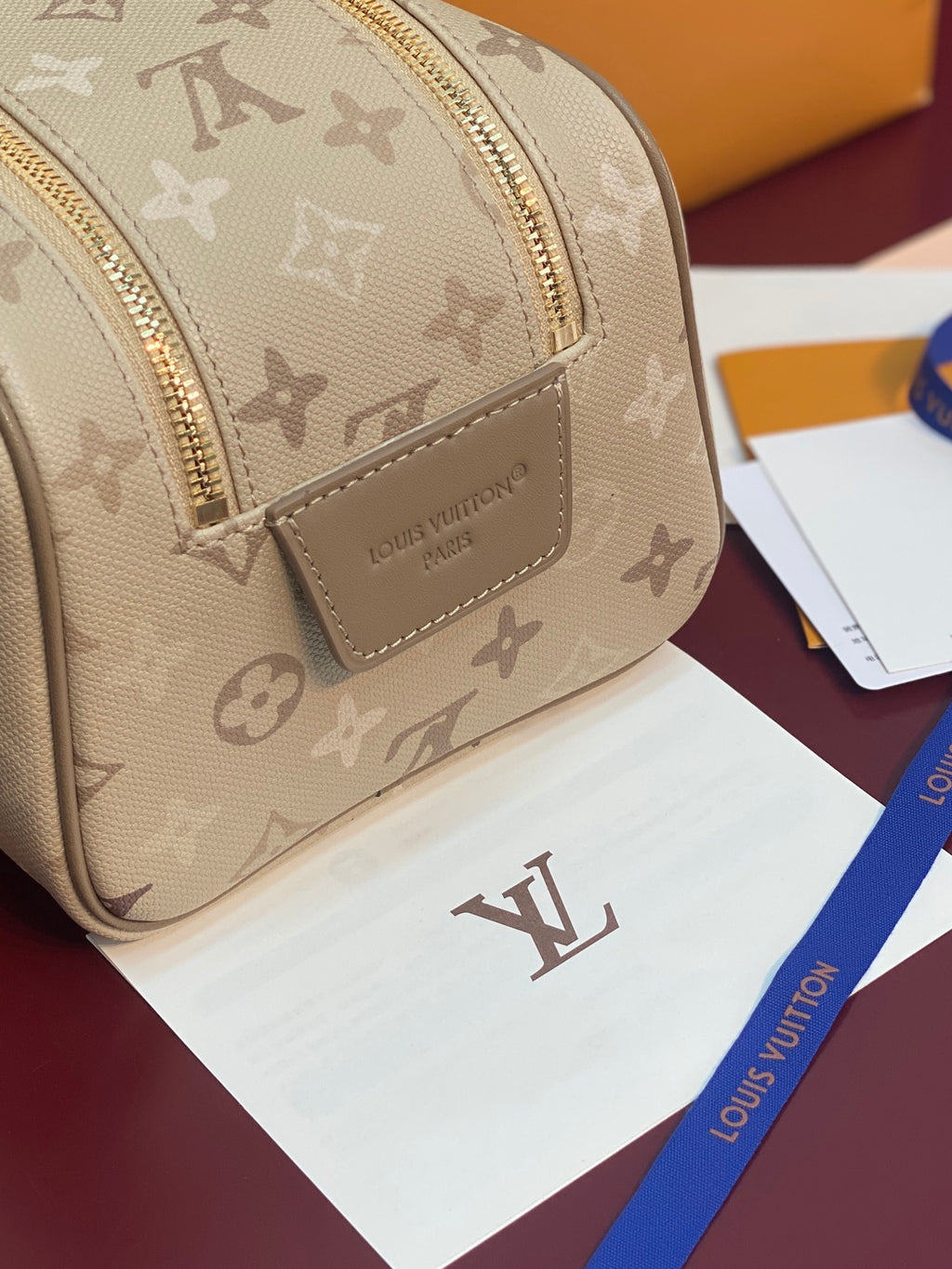 Louis Vuitton monogram crossbody bag, beige front with leather logo patch