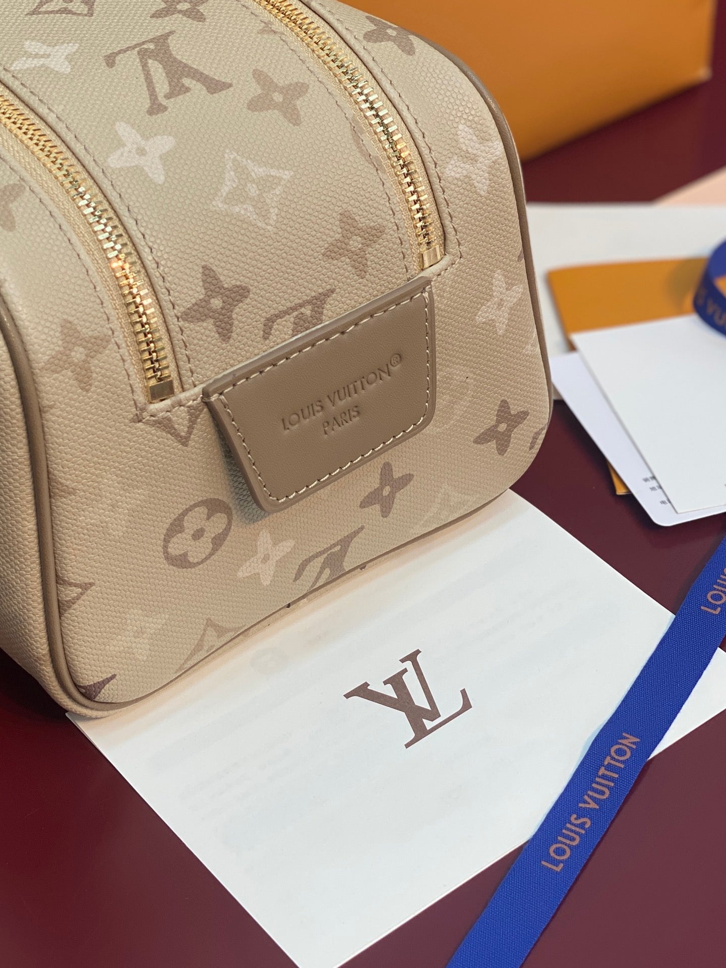 Louis Vuitton monogram crossbody bag, beige front with leather logo patch