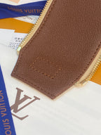 Louis Vuitton monogram bag back panel, brown leather patch with stitched logo