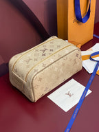 Louis Vuitton monogram crossbody bag, beige canvas with gold zipper and tan strap