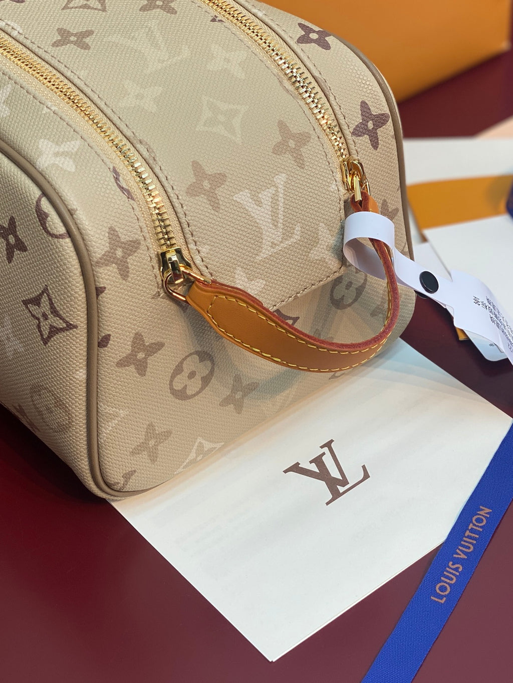 Louis Vuitton monogram crossbody bag, beige canvas with tan edge trim and gold zipper