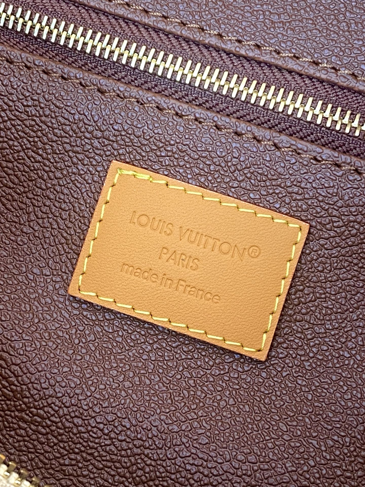 Louis Vuitton monogram bag leather tag, stitched rectangular label with Paris text