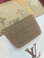 Louis Vuitton monogram bag corner, beige canvas with leather logo patch and gold zipper