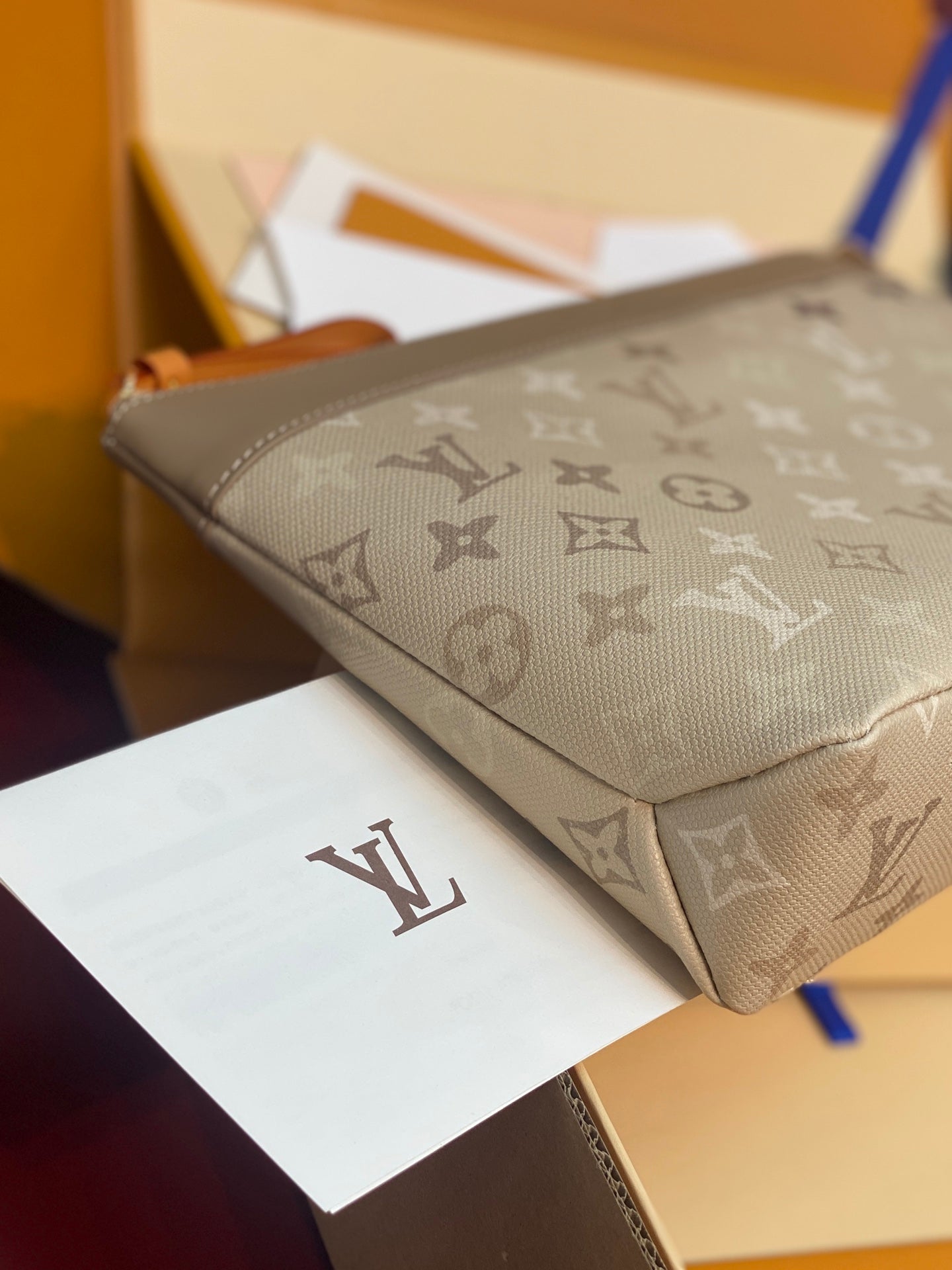Small monogram clutch pouch bag, beige patterned canvas with zipper seam