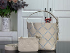 Louis Vuitton hobo bag with blue monogram pattern and tan top handle, plus crossbody pouch