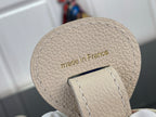 Louis Vuitton bag underside with stitched "made in France" text on light beige leather