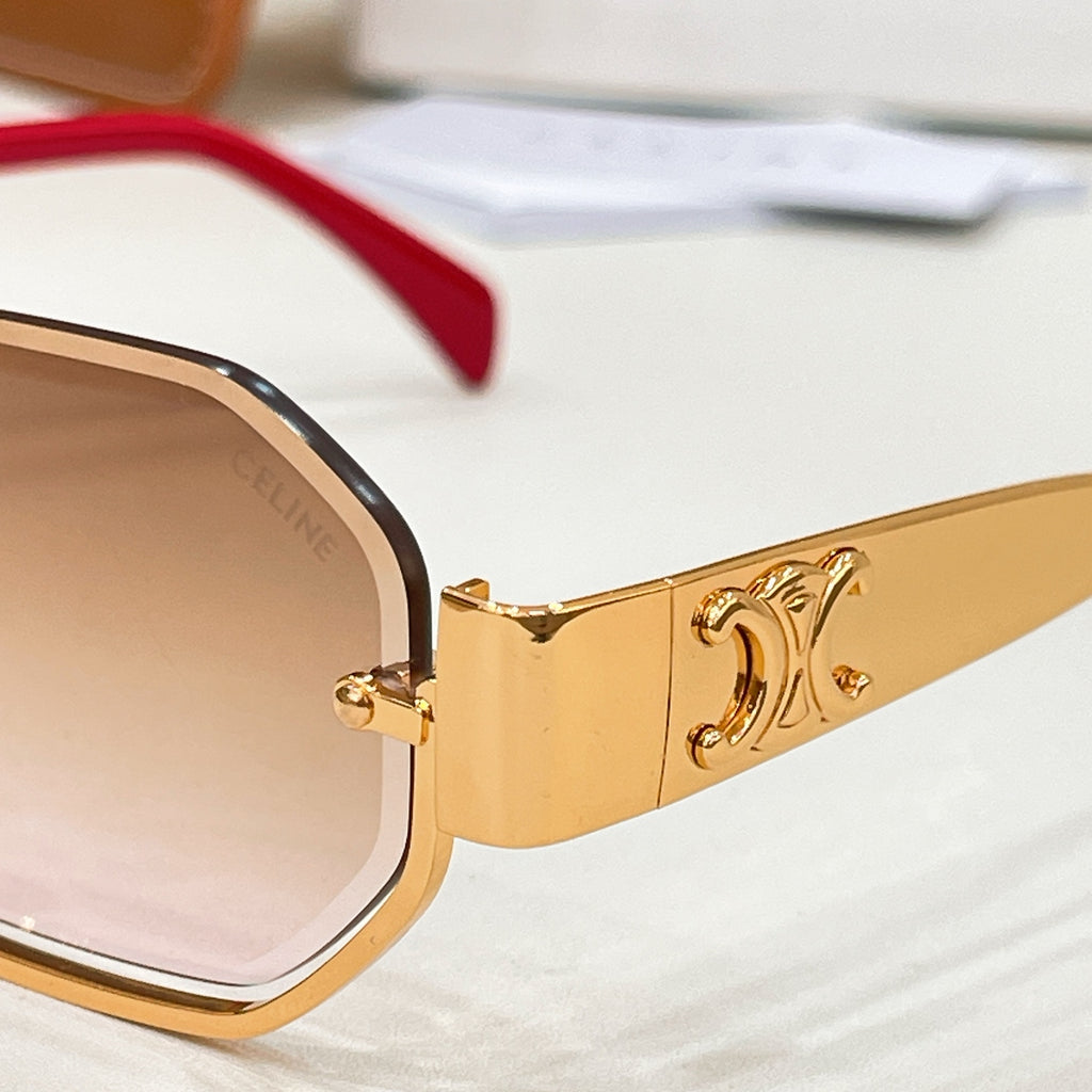 Celine sunglasses close-up of gold frame and hinge detail, with light pink lens