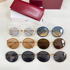 Gucci sunglasses assortment, round frames in gold, blue, brown, and black