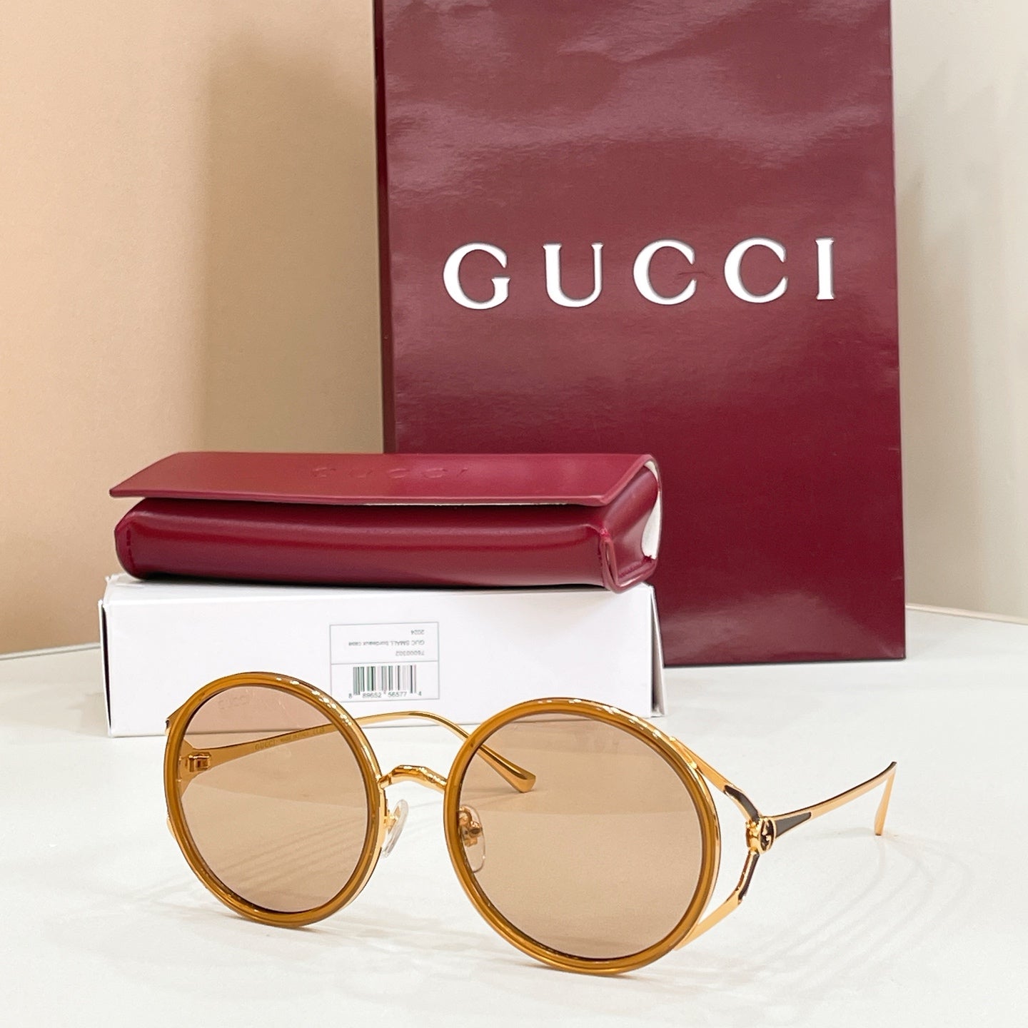 Gucci round sunglasses, gold frame with light tan lenses