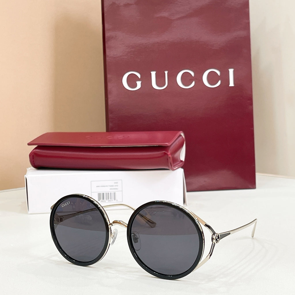 Gucci round sunglasses, black frame with dark tinted lenses