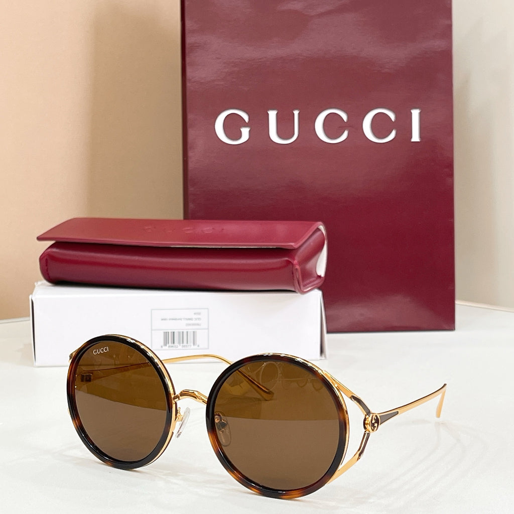 Gucci round sunglasses, gold frame with dark brown tinted lenses